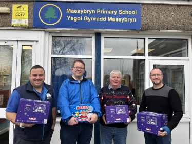 Joel with fellow community councillors, Brian James, Karl Johnson and Sam Trask outside Maesybryn Primary School