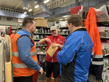 Joel meeting with Royal Mail staff at their sorting office in Cardiff