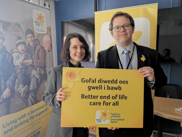 Joel James with Marie Curie representative
